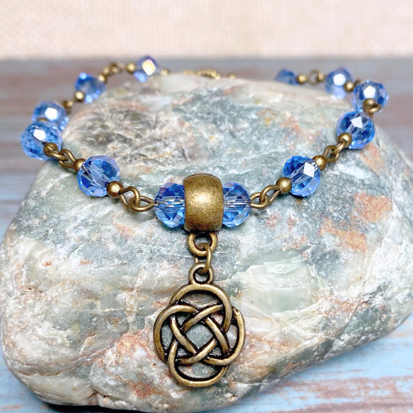 Bronze Knot Blue Glass Bracelet